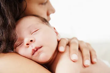 Mother holding a new baby